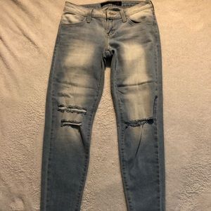 Blue jeans knee ripped